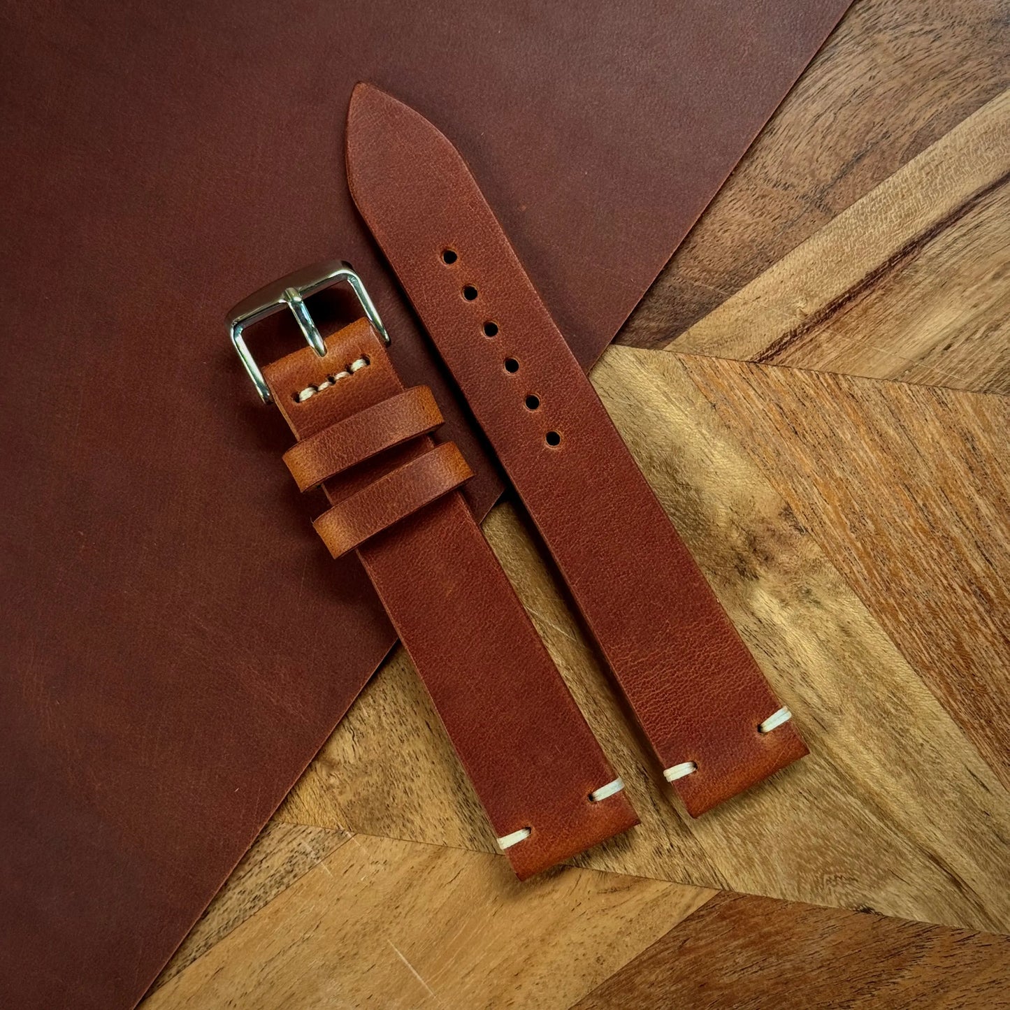 Tempesti Baku brown leather watch strap on a wooden surface